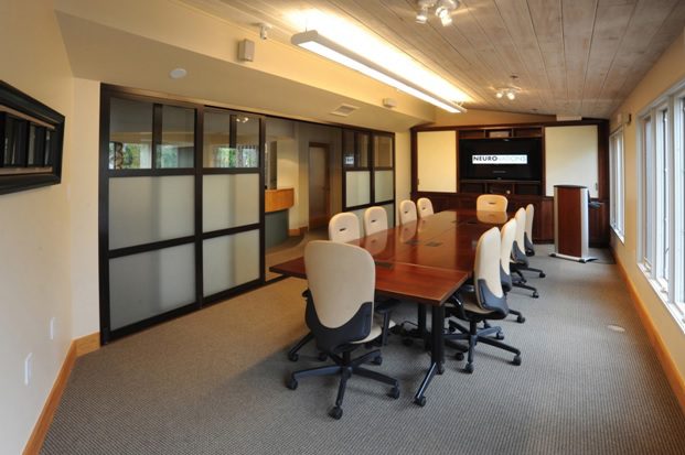 conference room with sliding glass door wall, some panels opaque