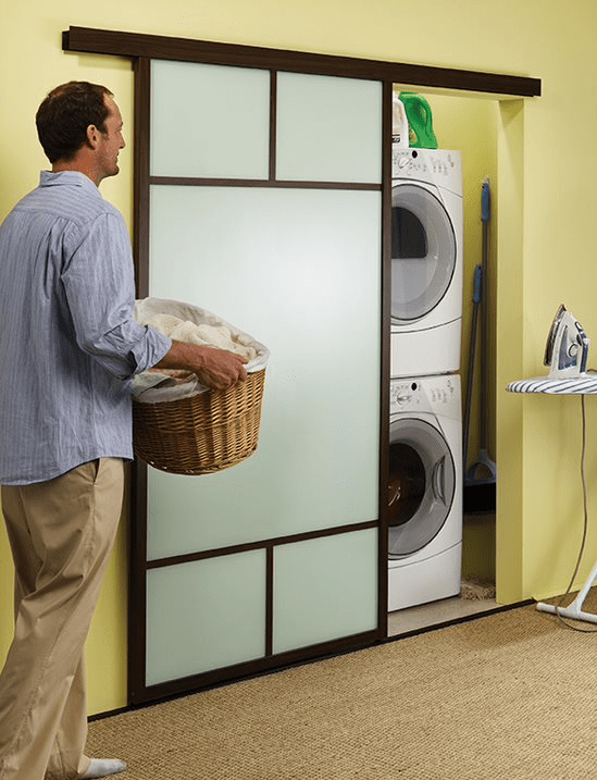 man doing laundry in room